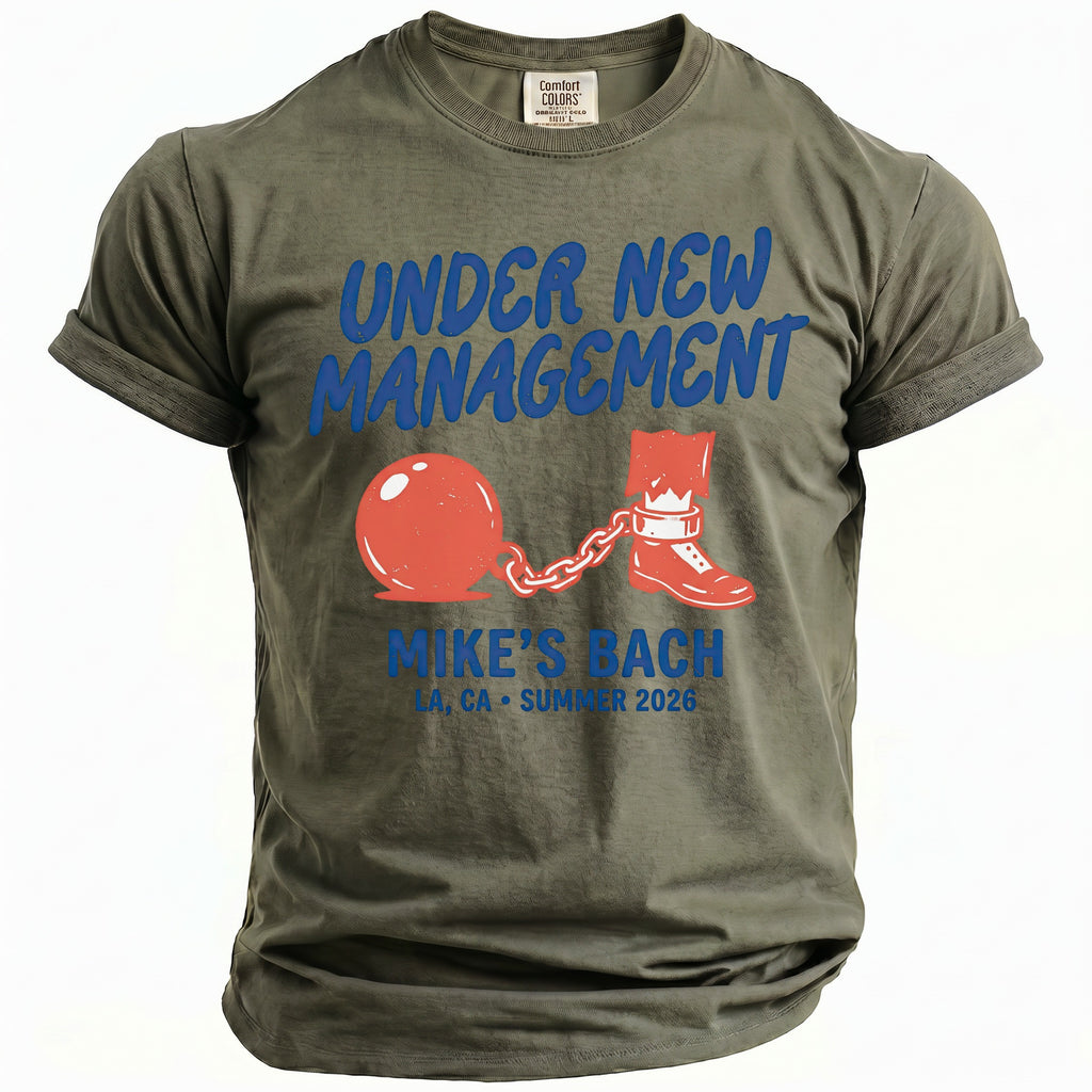 Khaki t-shirt with "Under New Management Mike's Bach" graphic.
