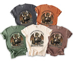 Five t-shirts in different colors with a dragon graphic and "Dragon my bachelor to the altar" text.