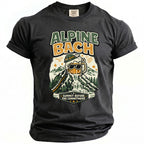 Dark grey t-shirt with graphic of beer mug waterfall on mountain, text "ALPINE BACH" and "SUMMIT BEFORE THE COMMITMENT".