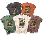 T-shirts in various colors with "Dragon Me to the Altar" bachelor party graphic.