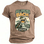 Brown t-shirt with "Alpine Bach" print depicting a beer mug on a mountain.
