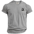 Grey Comfort Colors t-shirt with a black golf emblem on the chest.