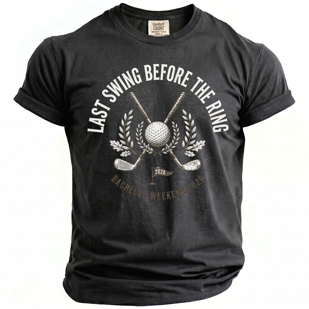 Dark gray t-shirt with golf graphic and text "Last Swing Before the Ring Bachelor Weekend 2026".