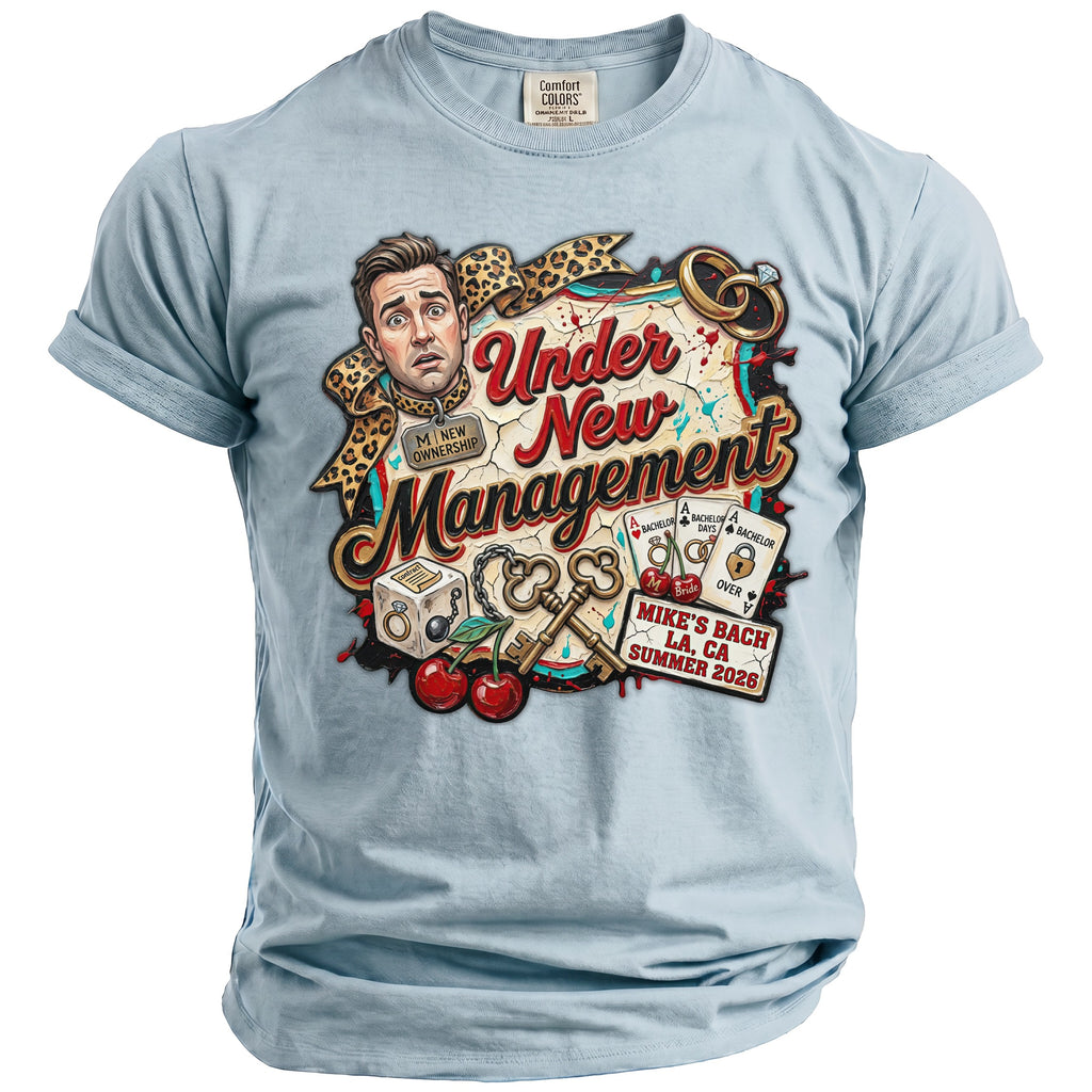 Light blue t-shirt with "Under New Management" graphic for Mike's Bach LA 2026.