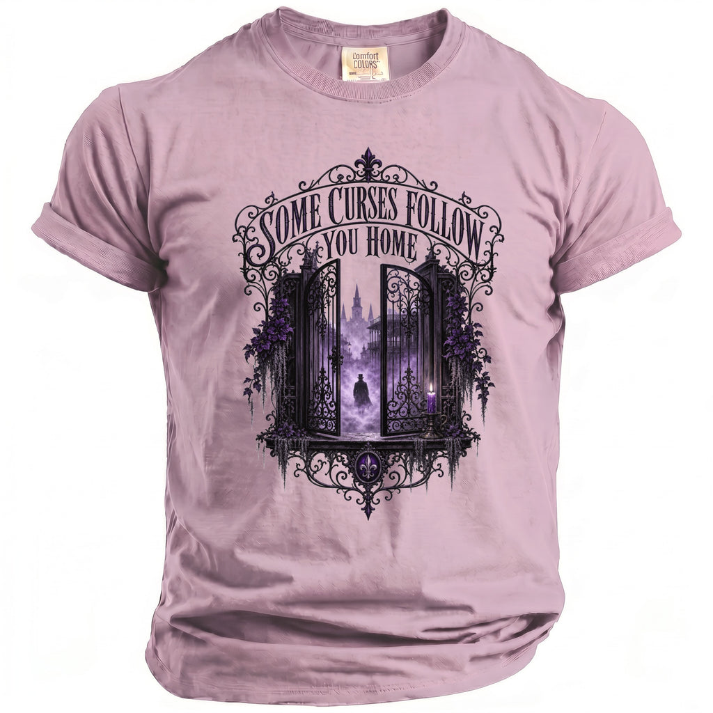 Purple t-shirt with gate opening to foggy city, figures, and text.