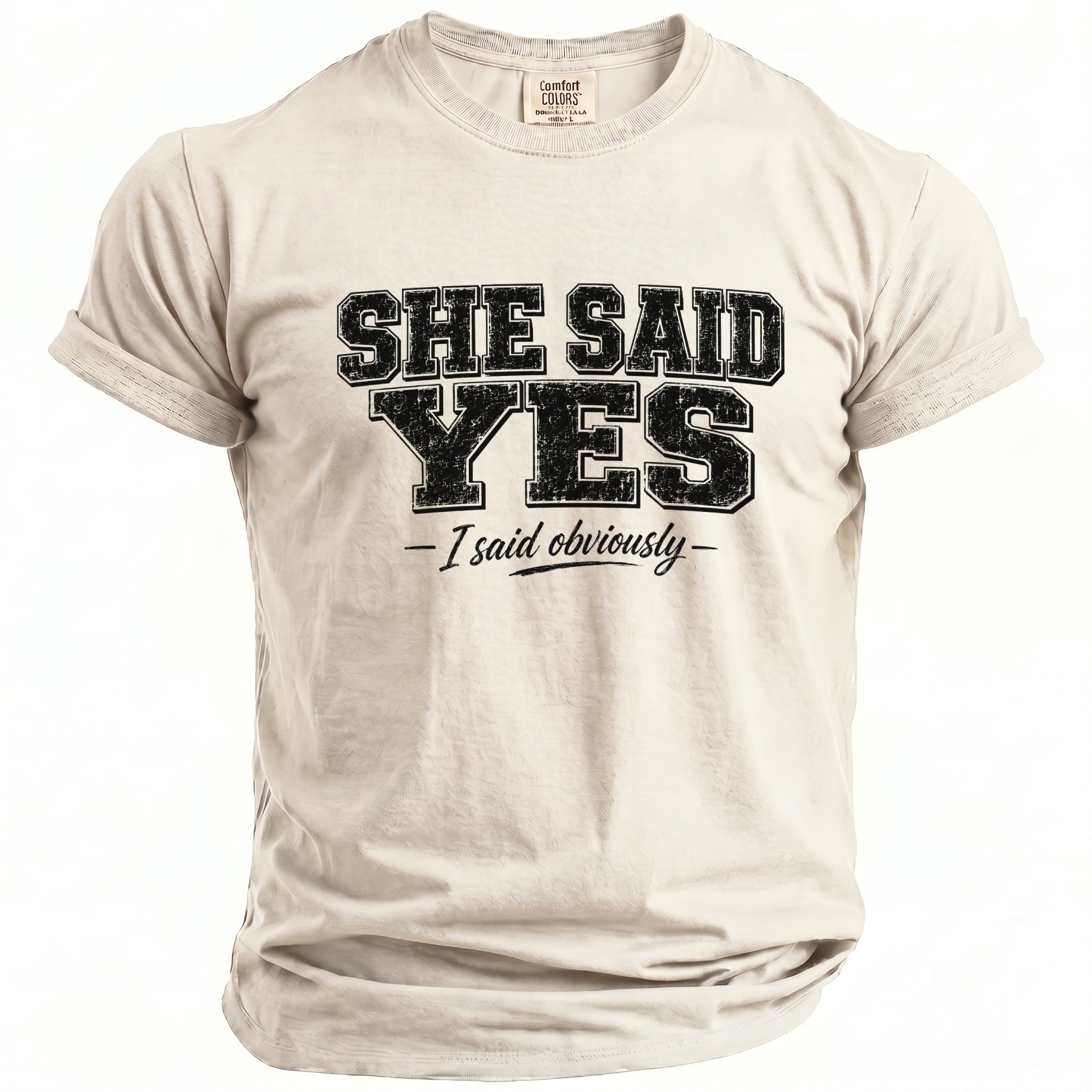 Light beige t-shirt with black text reading "SHE SAID YES - I said obviously -".