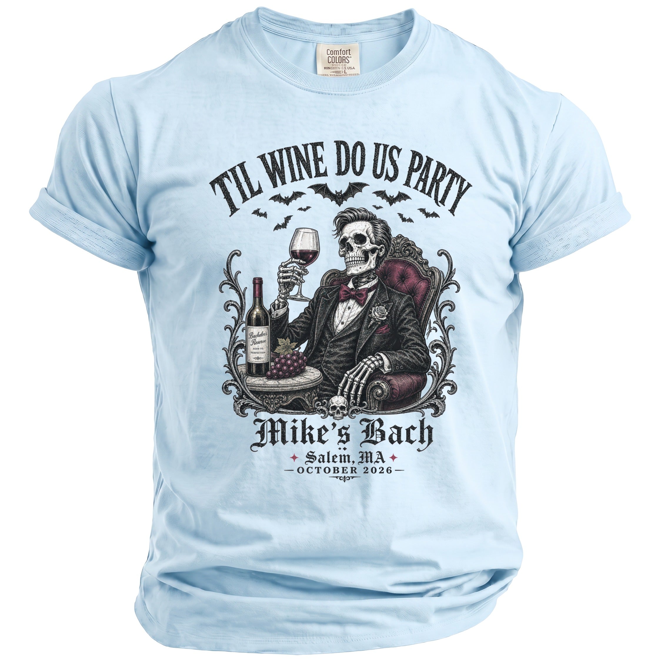 Light blue t-shirt with skeleton in suit, wine, and text "Til Wine Do Us Party Mike's Bach".