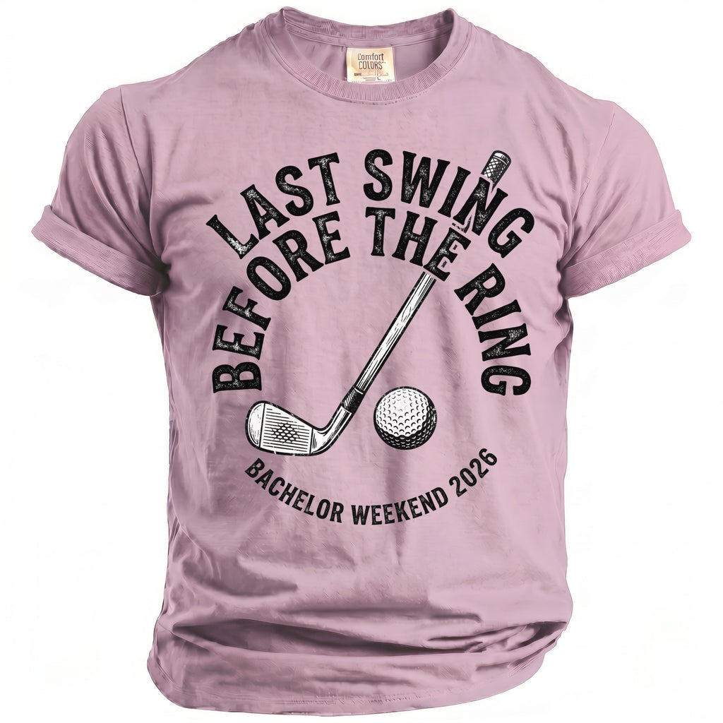 Pink t-shirt with "Last Swing Before The Ring Bachelor Weekend 2026" text and golf club.