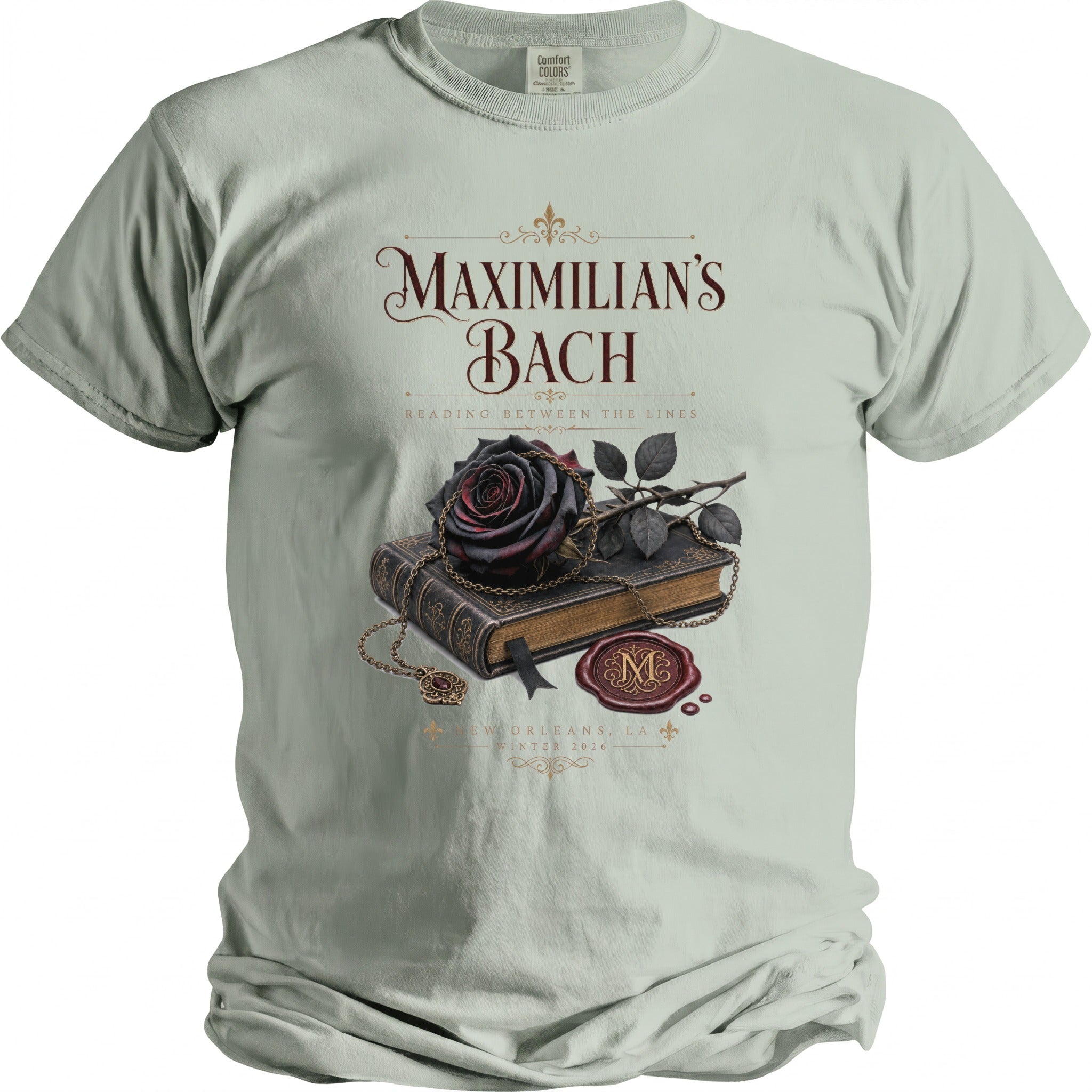 Shirt with "Maximilian's Bach" text, a book, rose, necklace, and seal.