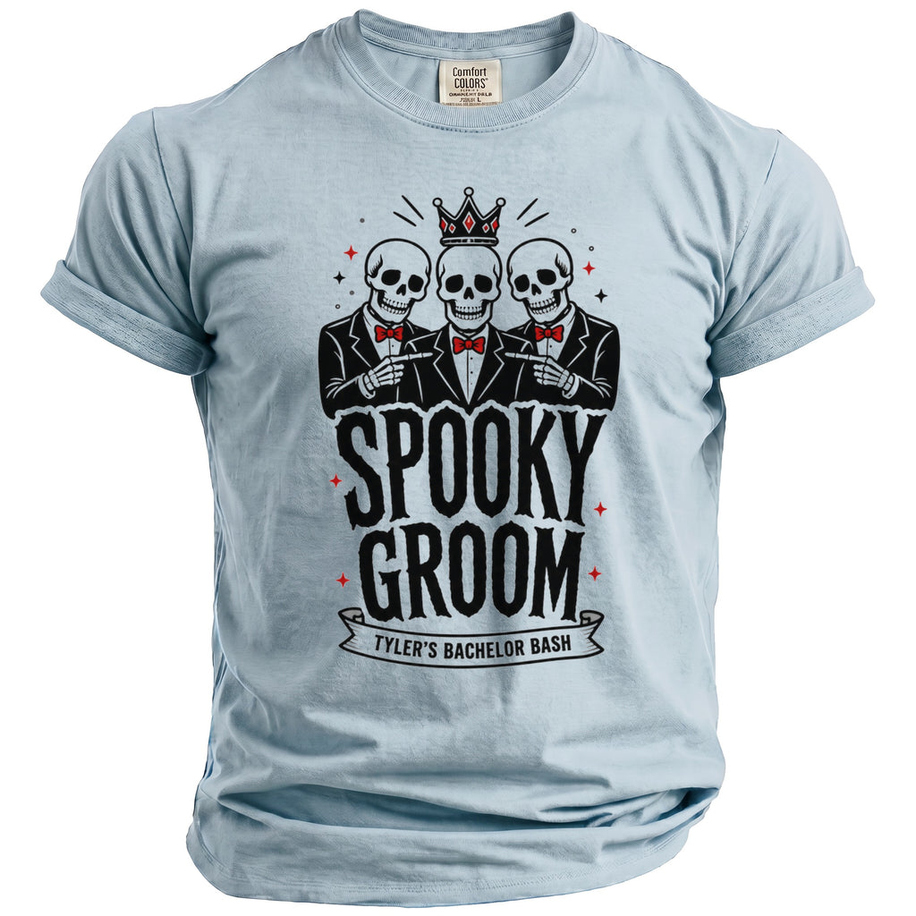 Light blue t-shirt with "Spooky Groom Tyler's Bachelor Bash" text and three skeletons.
