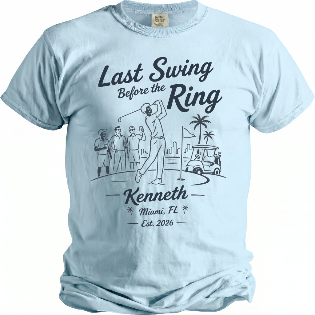 Light blue t-shirt with "Last Swing Before the Ring, Kenneth, Miami, FL Est. 2026" text.