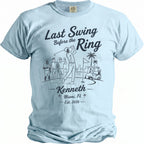 Light blue t-shirt with "Last Swing Before the Ring, Kenneth, Miami, FL Est. 2026" text.