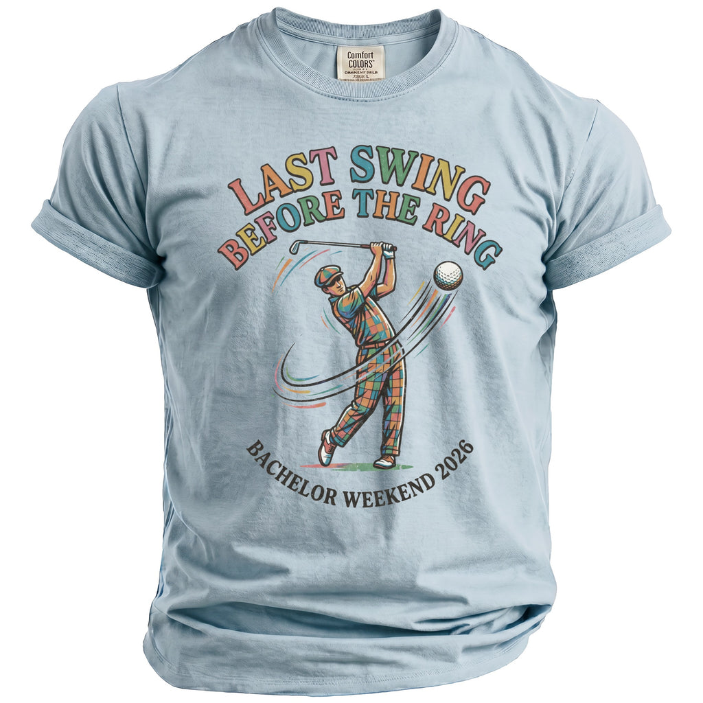 Light blue t-shirt with text "LAST SWING BEFORE THE RING BACHELOR WEEKEND 2026" and graphic.