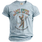 Light blue t-shirt with text "LAST SWING BEFORE THE RING BACHELOR WEEKEND 2026" and graphic.