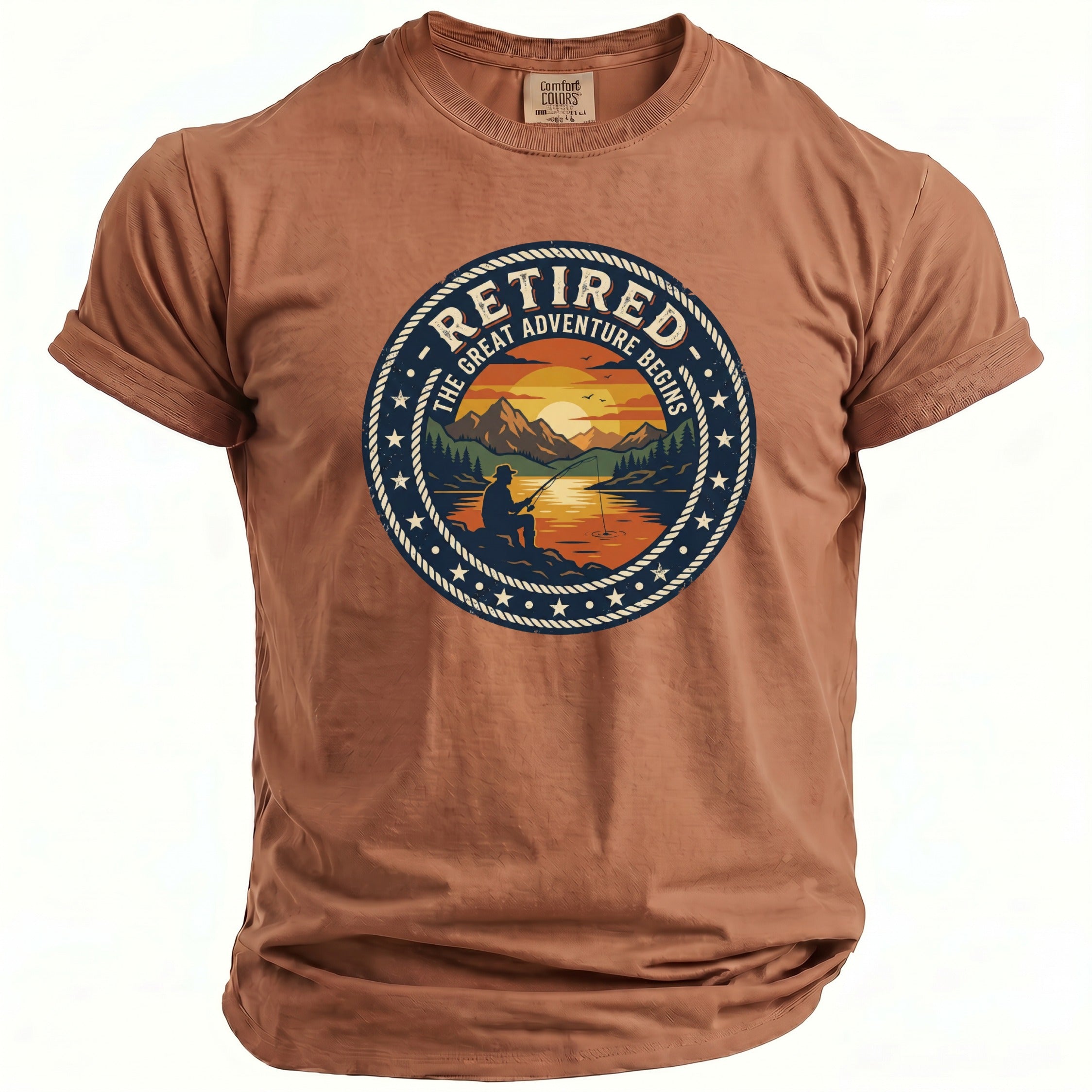 Brown t-shirt with graphic of a fisherman and sunset with text "Retired The Great Adventure Begins".