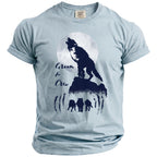 Light blue t-shirt with navy graphic of wolves, a full moon, and text reading "Groom & Crew".