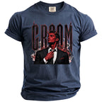 Dark blue t-shirt with red devil adjusting tie and "GROOM" text.