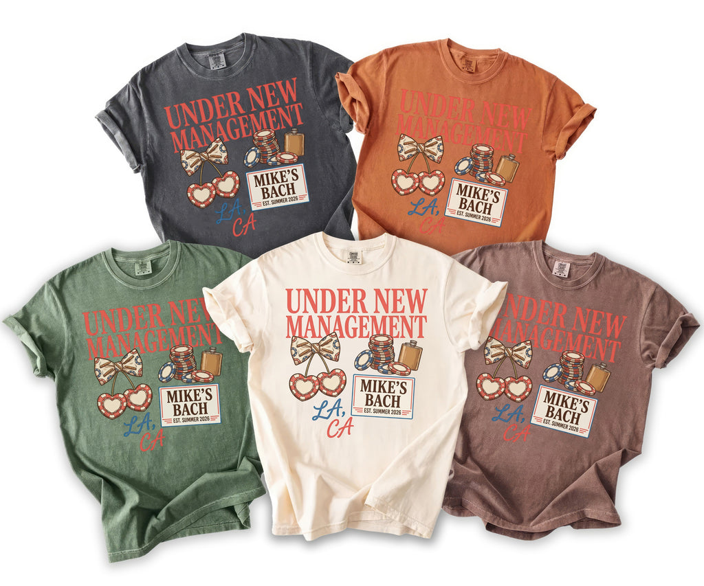 T-shirts in multiple colors featuring "UNDER NEW MANAGEMENT" and "MIKE'S BACH LA, CA" graphics.