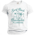 White t-shirt with turquoise text and graphics reading "Surf Bachelor Planning".