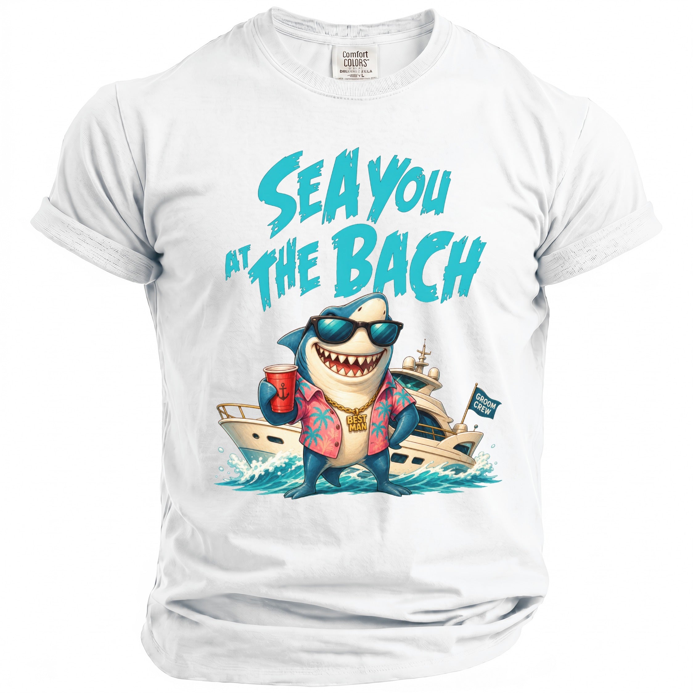 A white t-shirt featuring a shark wearing sunglasses, a shirt, and a gold chain, in front of a yacht with the text Sea You At The Bach above.