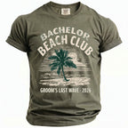 Olive green t-shirt with "Bachelor Beach Club Groom's Last Wave 2026" text and palm tree graphic.