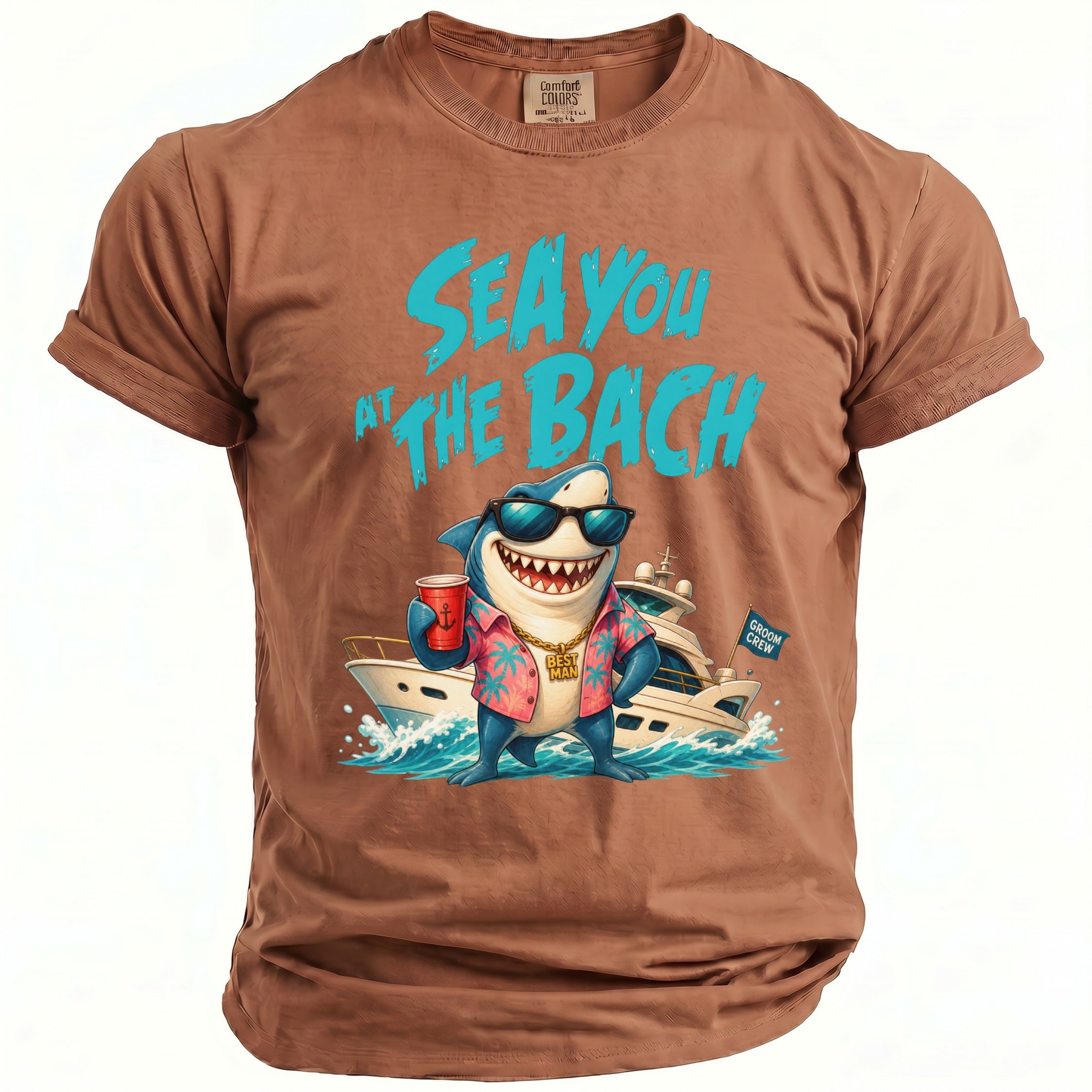 Brown crewneck t-shirt with a cartoon shark in sunglasses, a Hawaiian shirt, holding a red cup, standing in front of a yacht with the text Sea You at the Bach above it.