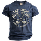 Navy t-shirt with "Last Swing Before the Ring Bachelor Weekend 2026" and golf clubs.