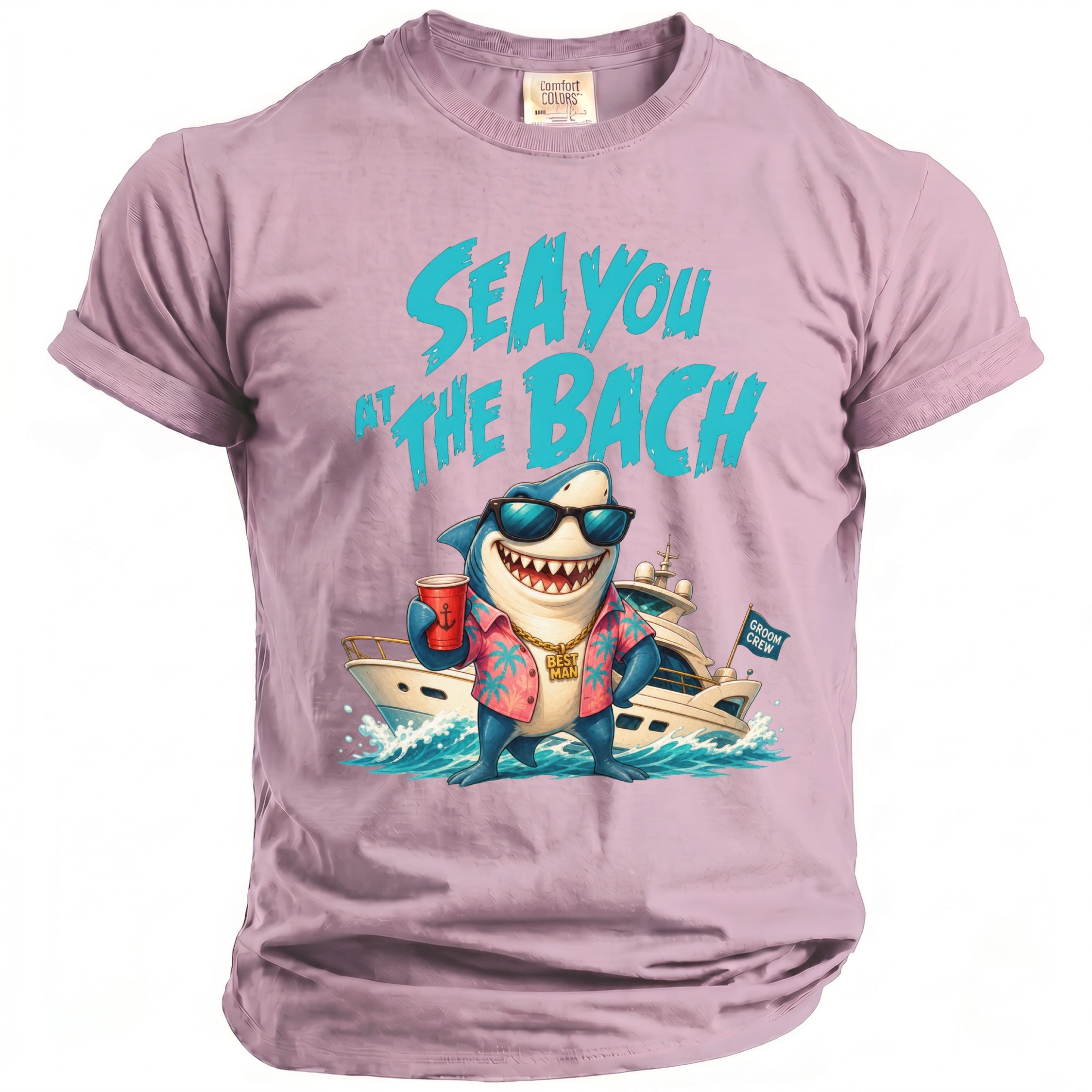 Light purple t-shirt featuring a shark graphic wearing sunglasses, a shirt, and a gold chain, with the text SEA YOU AT THE BACH.