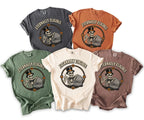 Five comfort colors t-shirts in grey, orange, green, cream, and brown, each displaying a skeleton graphic.