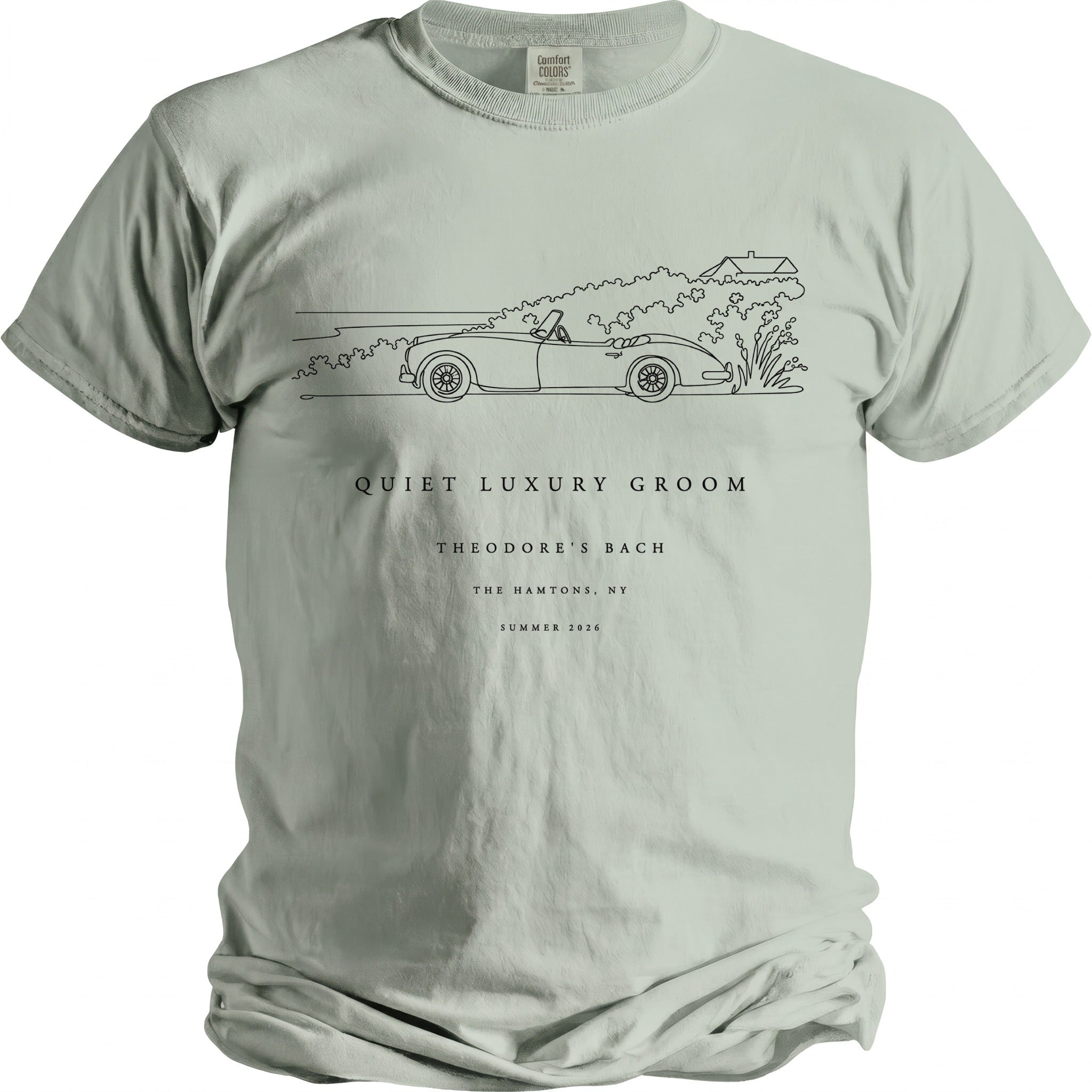 T-shirt with line drawing of convertible car and text: Quiet Luxury Groom, Theodore's Bach, The Hamptons, NY, Summer 2026.