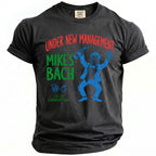 Dark gray t-shirt with red and green text about "Mike's Bach".