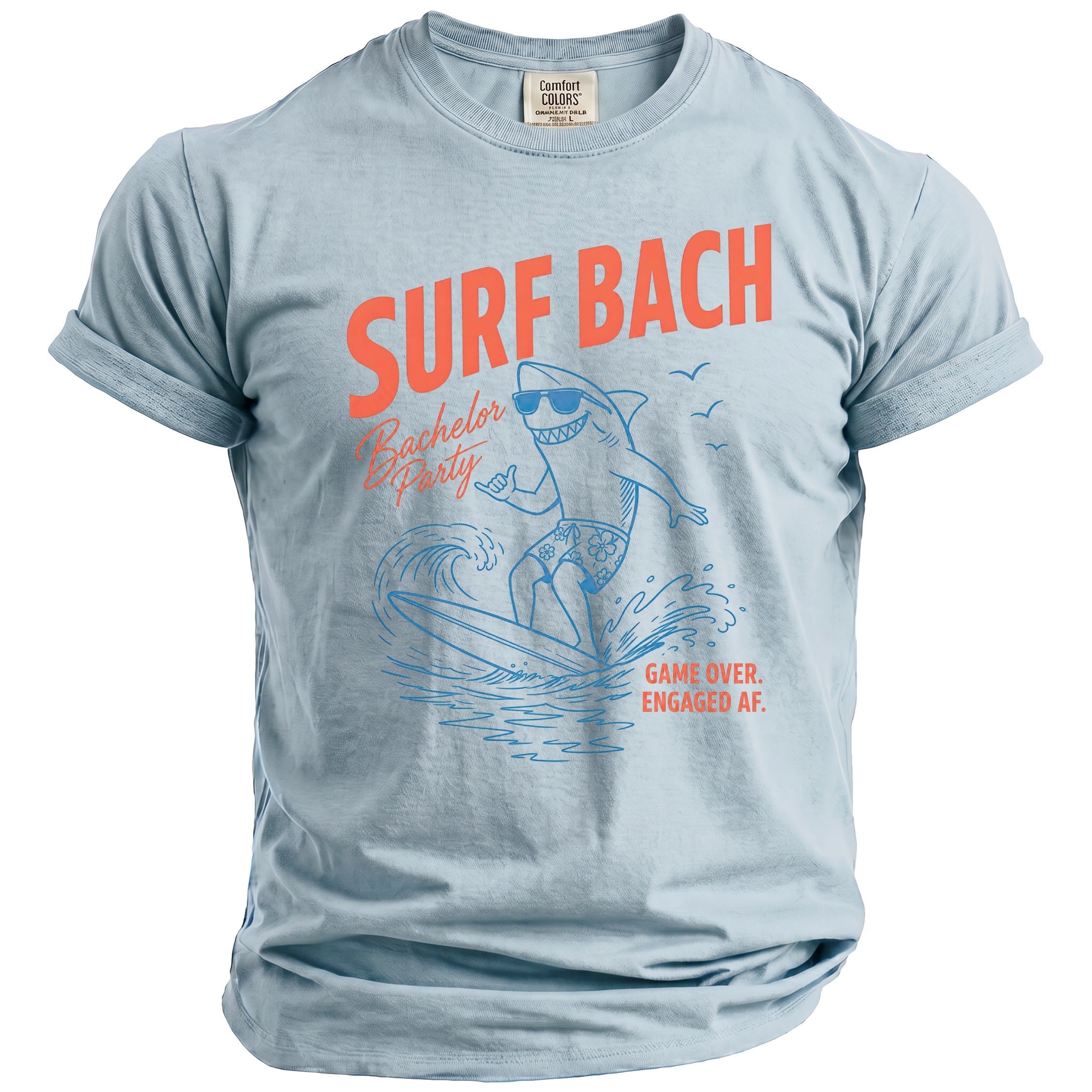 Light blue t-shirt with orange text "SURF BACH Bachelor Party" and shark graphic.