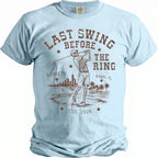 Light blue t-shirt with brown graphic: Skeleton golfing, "Last Swing Before The Ring," Kenneth, Miami, FL, Est. 2026