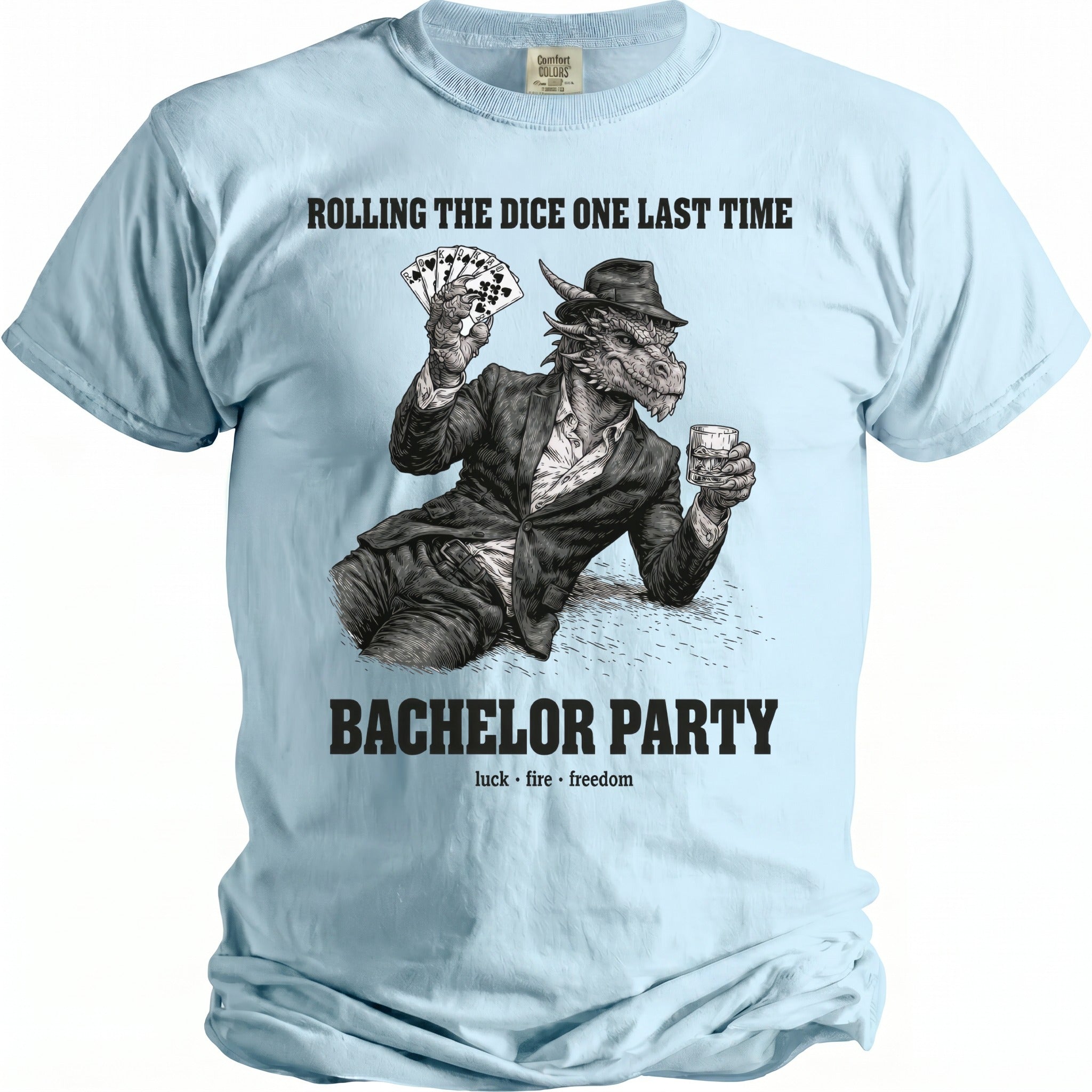 Light blue t-shirt with text "Rolling the Dice One Last Time" and a dragon holding cards and whiskey.