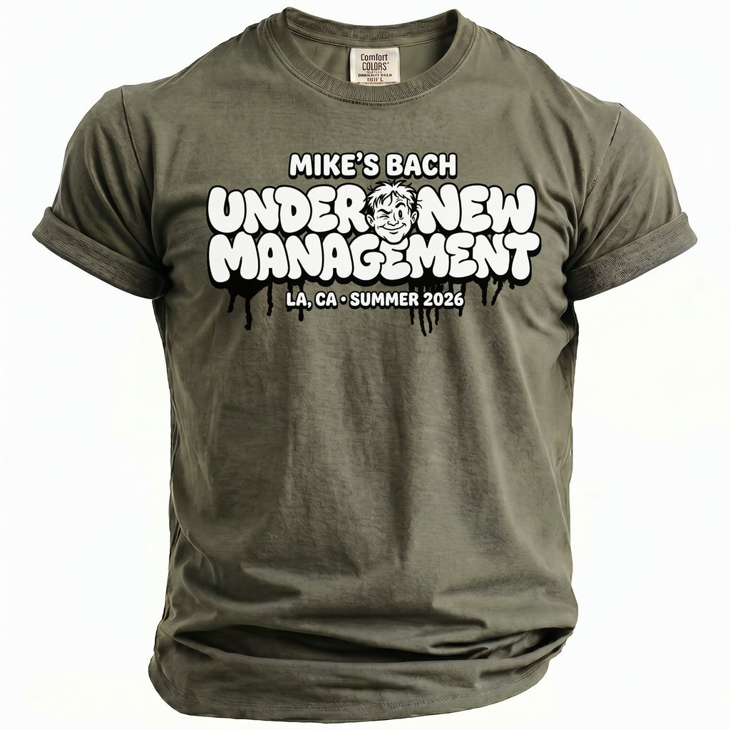 Olive green t-shirt with "MIKE'S BACH UNDER NEW MANAGEMENT LA, CA SUMMER 2026" graphic.