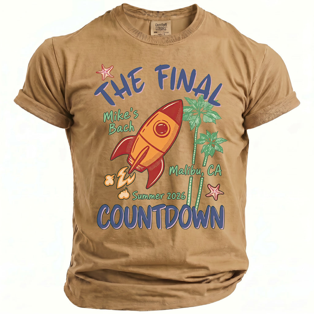 Brown t-shirt with rocket, palm trees, and text "The Final Bach Countdown Summer 2026 Malibu, CA".