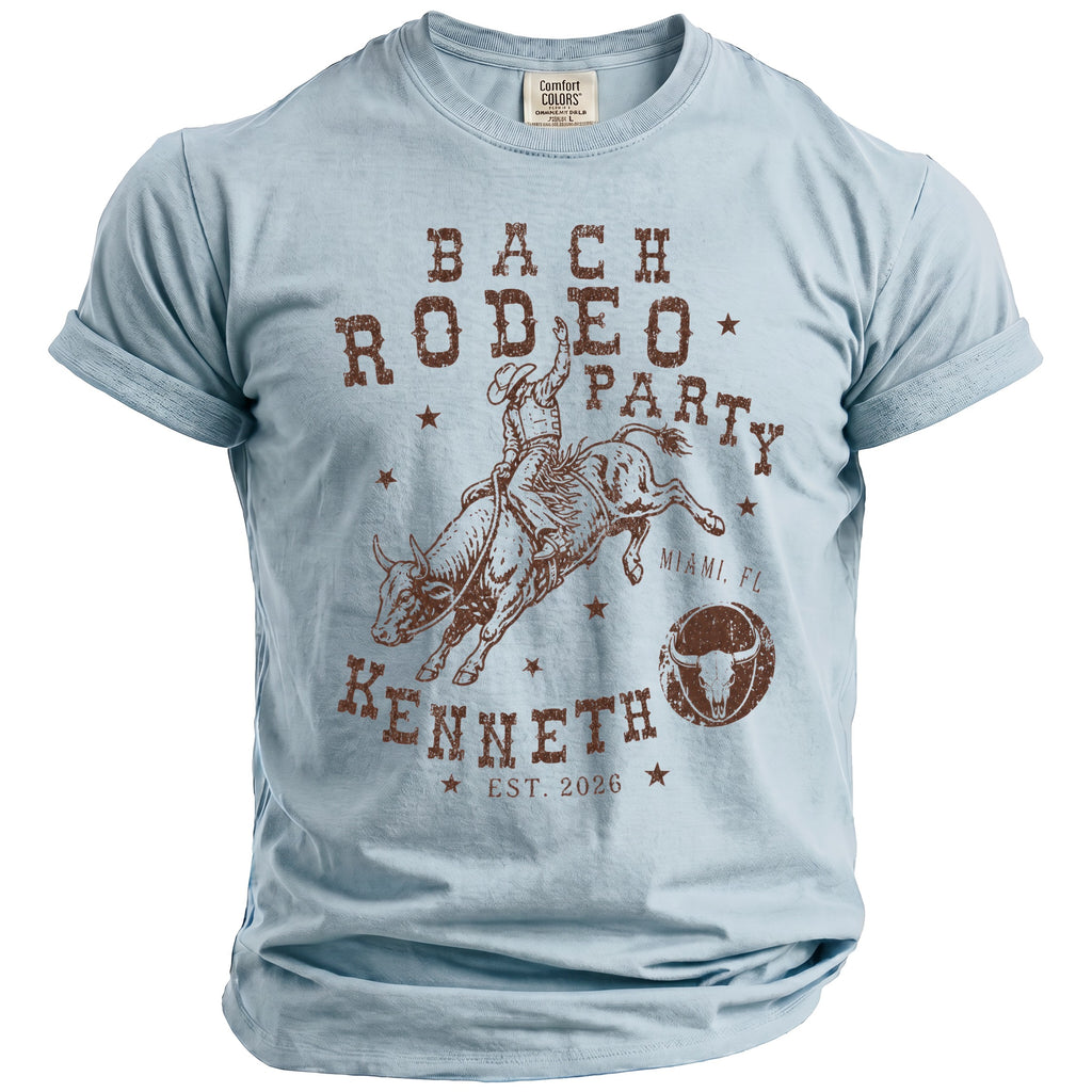 Light blue t-shirt with "BACH RODEO PARTY Kenneth Est. 2026" graphic.