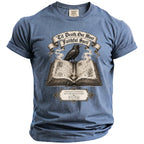 Blue t-shirt with raven perched on an open book, quoting "Til Death, Our Most Faithful Spell."