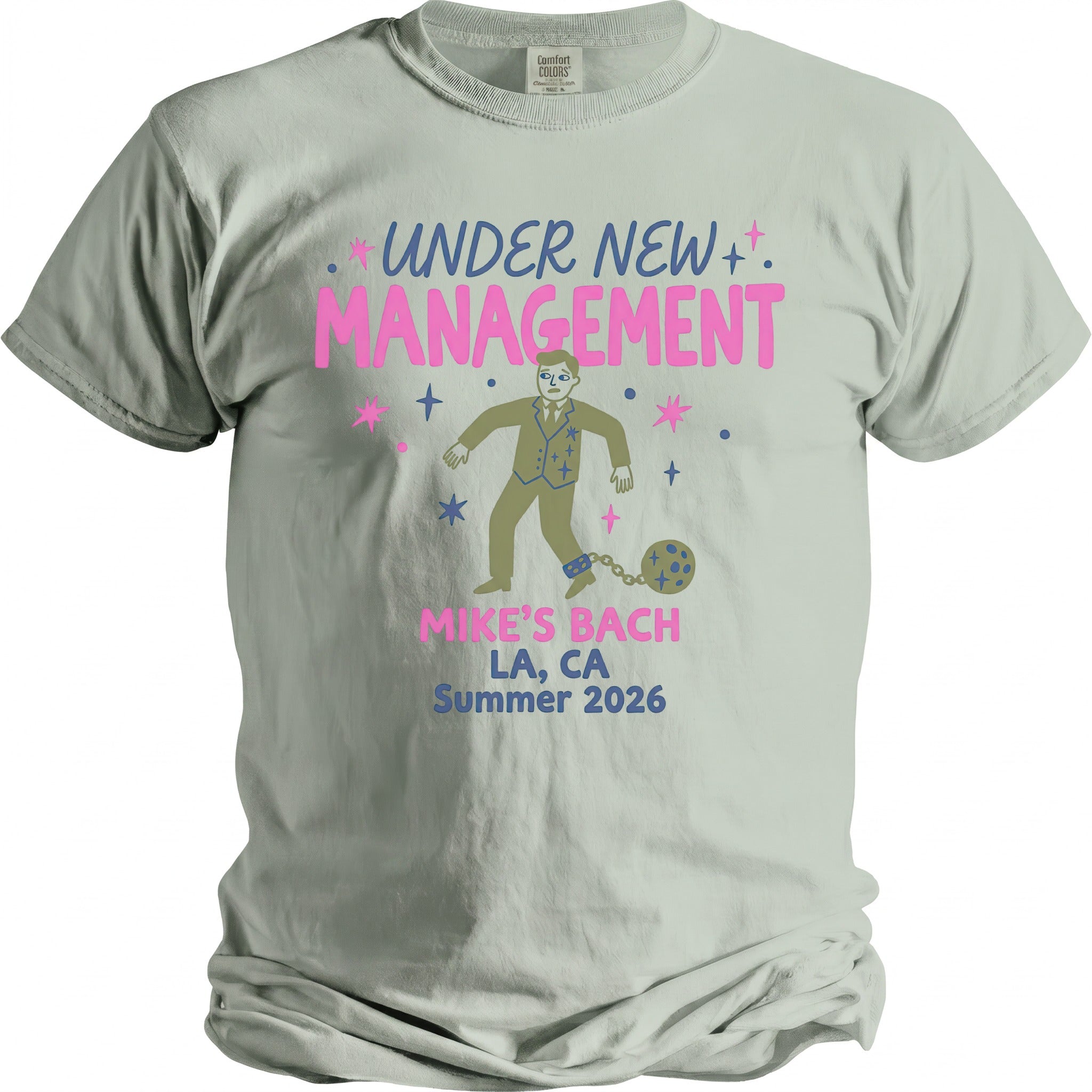 T-shirt graphic: "Under New Management" with man shackled to ball, "Mike's Bach LA, CA Summer 2026".