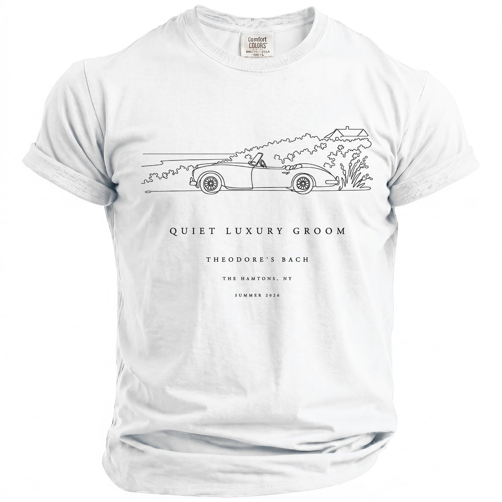 White t-shirt with a line drawing of a convertible and text "QUIET LUXURY GROOM THEODORE'S BACH THE HAMTONS, NY SUMMER 2026".