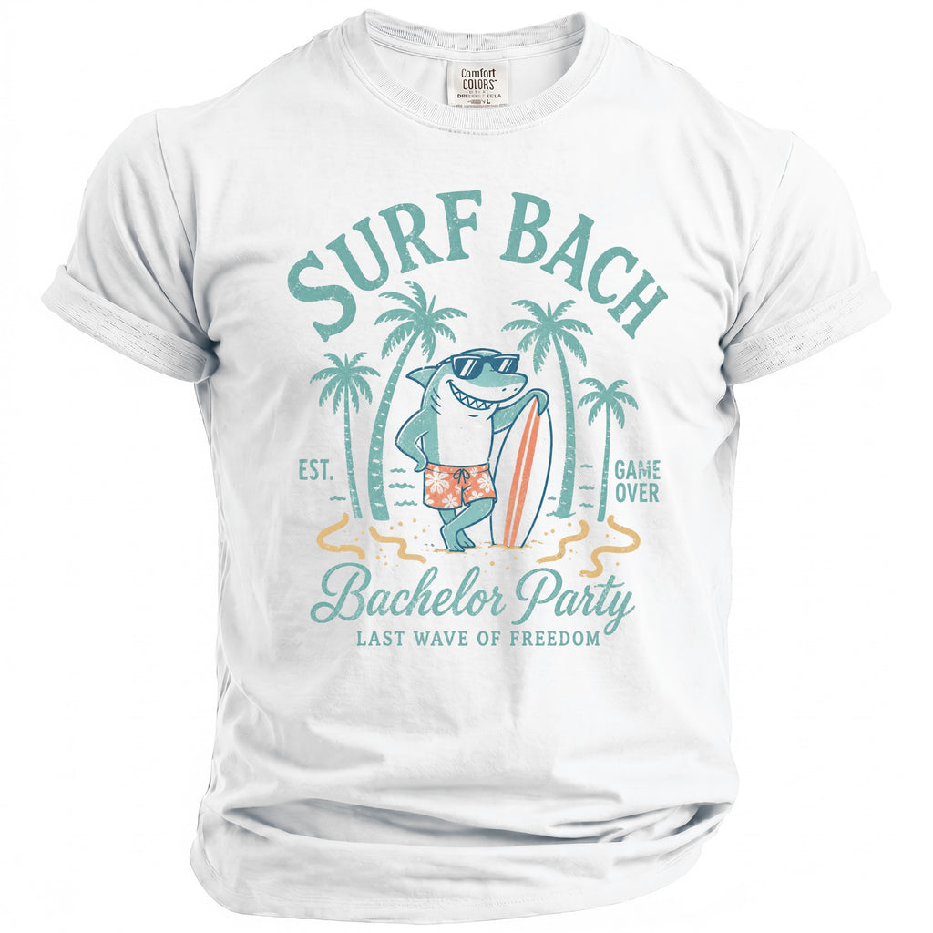 White t-shirt with a graphic of a shark and surfboard, saying "Surf Bach" and "Bachelor Party".