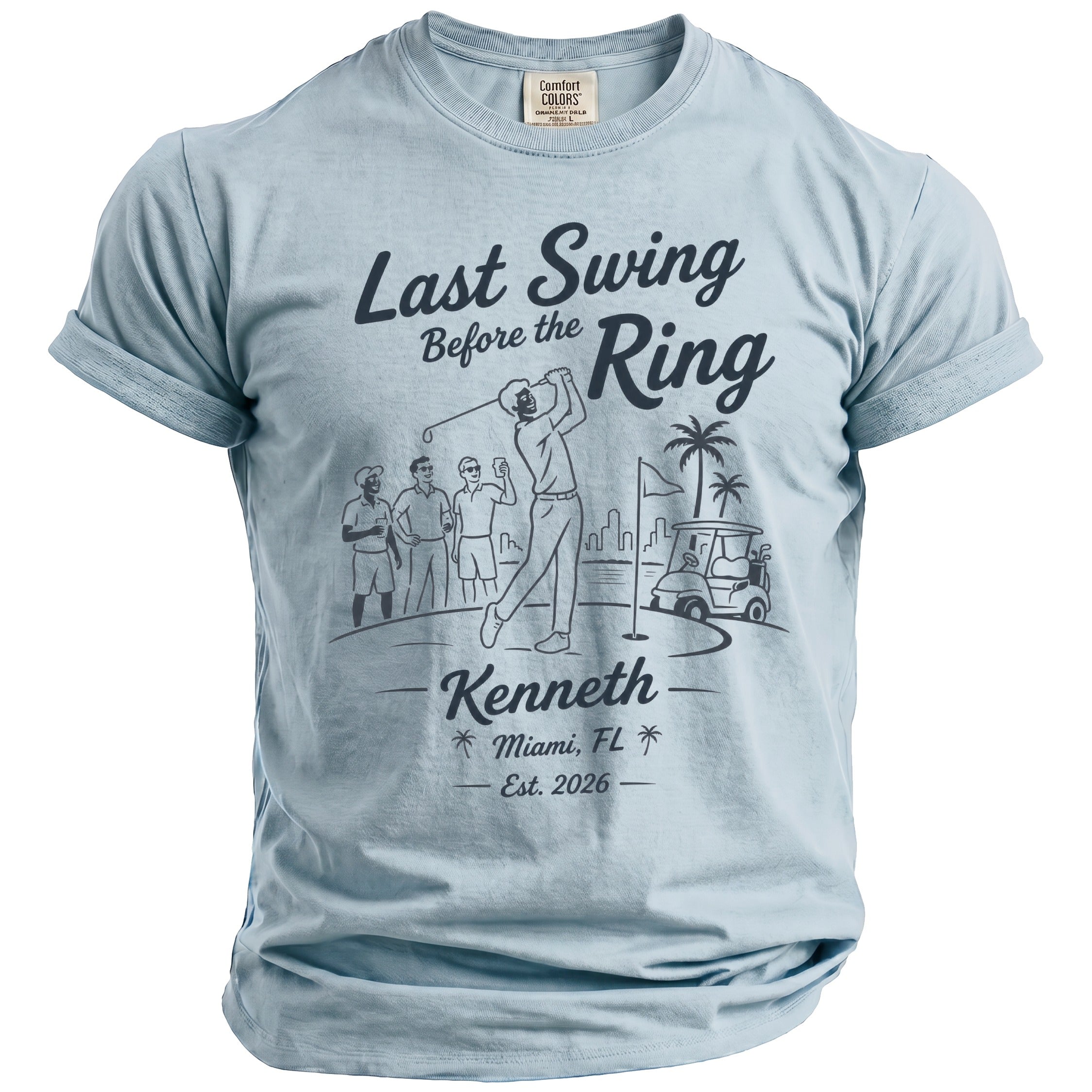 Light blue t-shirt with a graphic of a golfer, friends, golf cart, and text.