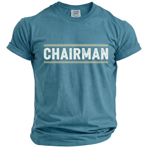 Teal t-shirt with "CHAIRMAN" text in distressed white letters within a striped box.
