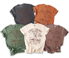 Five t-shirts in different colors featuring a skeleton golfer and "Last Swing Before The Ring" text.