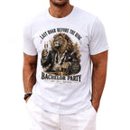 White t-shirt with graphic of a lion holding a champagne glass, "Last Roar Before the Ring".