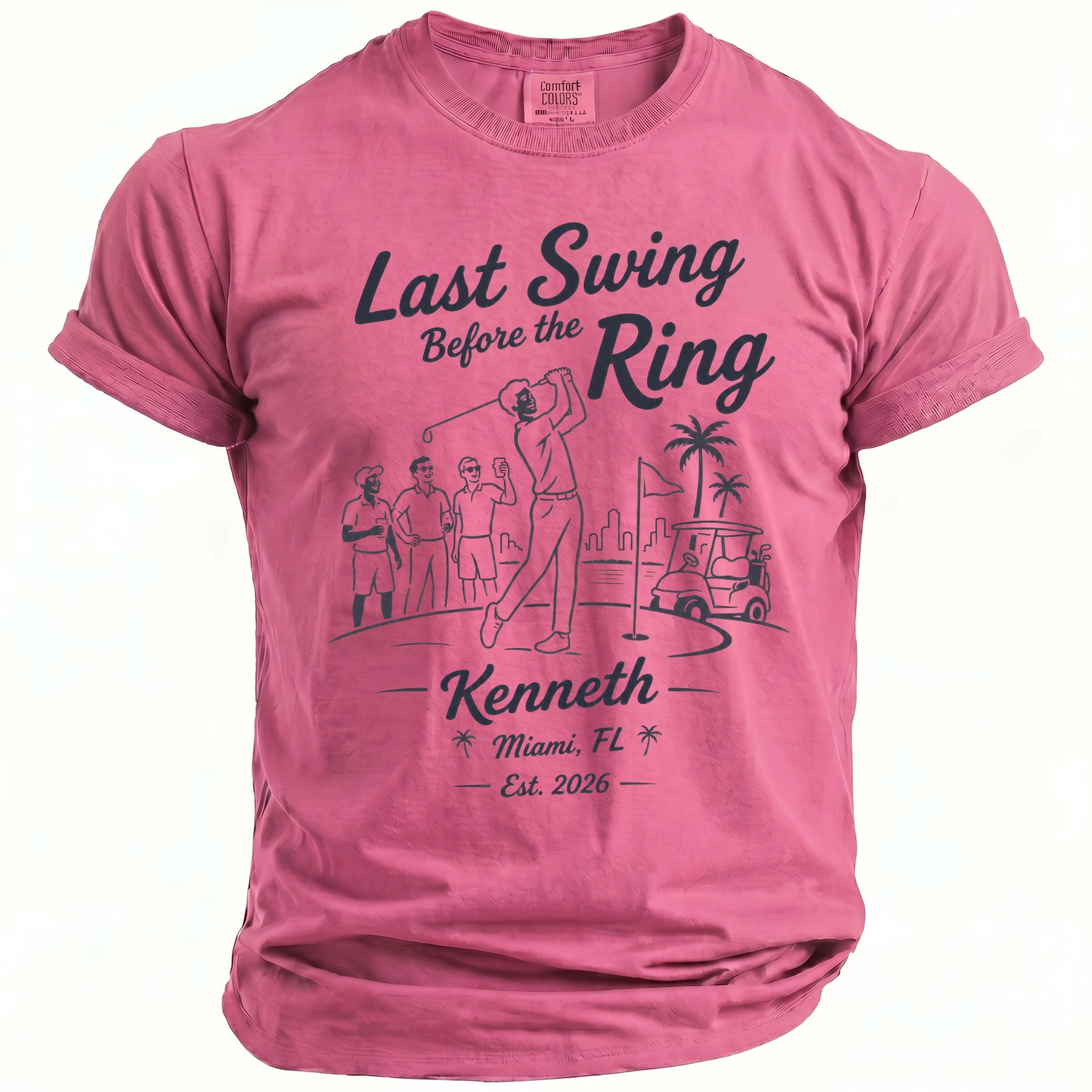 Pink t-shirt with "Last Swing Before the Ring" golf graphic and "Kenneth Miami, FL Est. 2026" text.