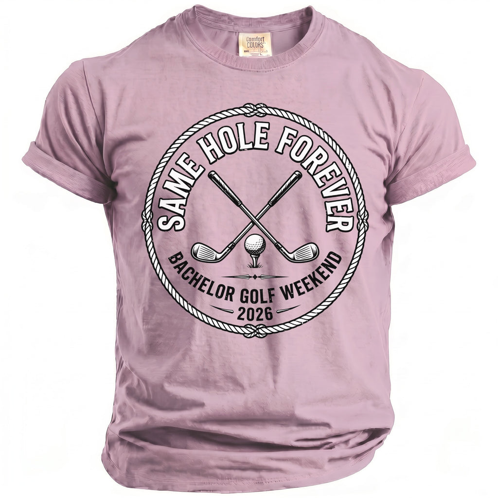 Pink t-shirt with circular design: "Same Hole Forever Bachelor Golf Weekend 2026"