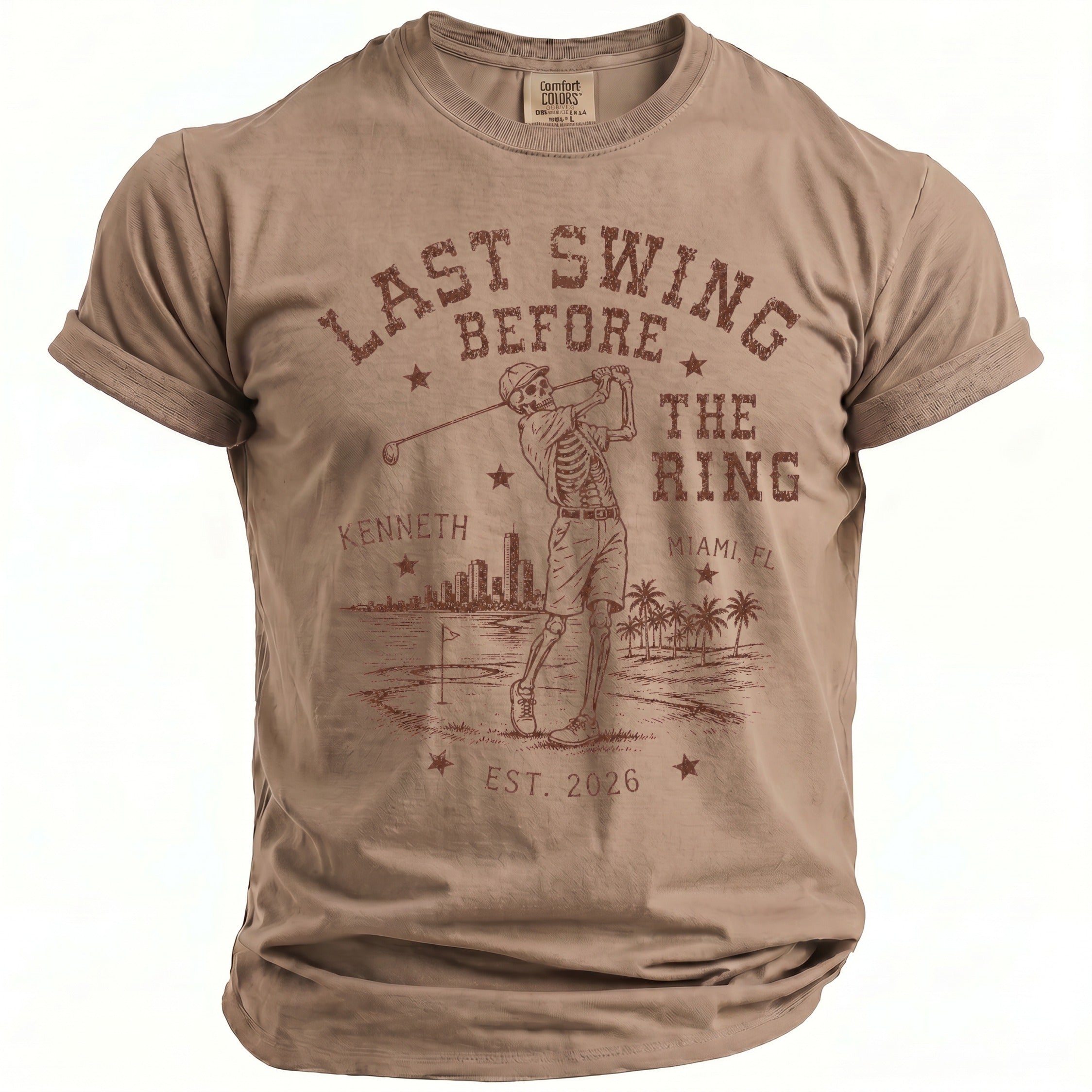 T-shirt with skeleton golfer graphic, "Last Swing Before The Ring" text, and Miami skyline.