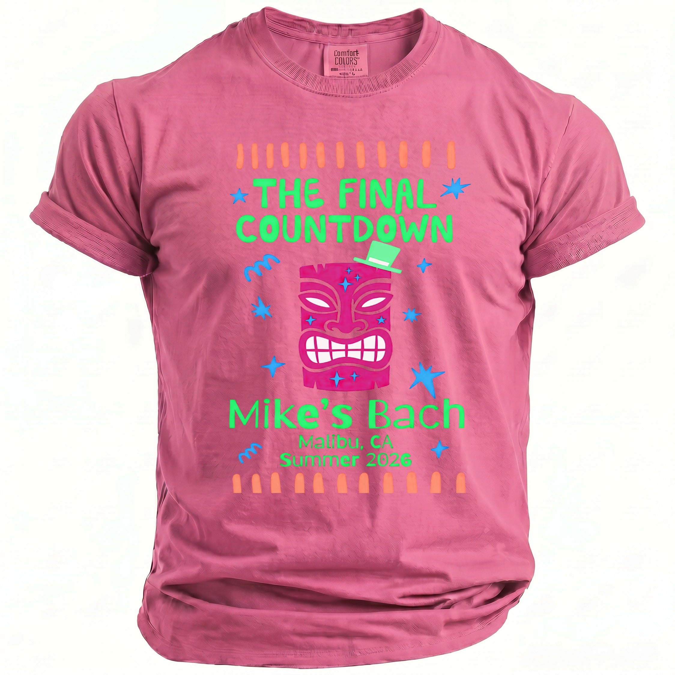Pink t-shirt with "The Final Countdown" and "Mike's Bach" text featuring a tiki mask.