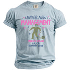 Light blue t-shirt with "Under New Management" and bachelor party details.